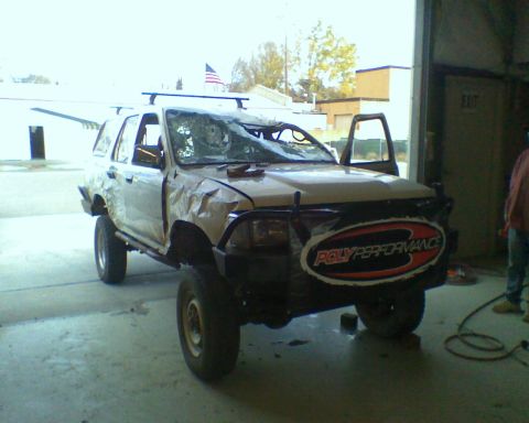 1993 Toyota 4Runner - This 1993 Toyota 4Runner shows significant damage to its body and windshield, with a Poly Performance sticker visible on the front.
