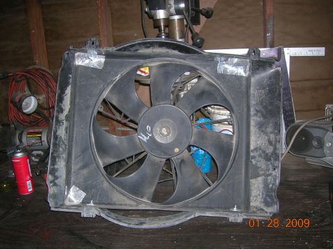 1985 Ford Bronco - A radiator fan assembly is shown, with some handwritten markings on its central hub.