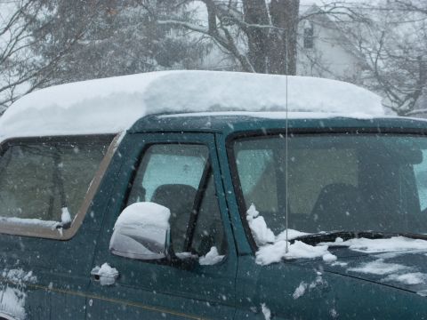 1996 Ford Bronco - Ford Bronco covered in snow during a winter storm.