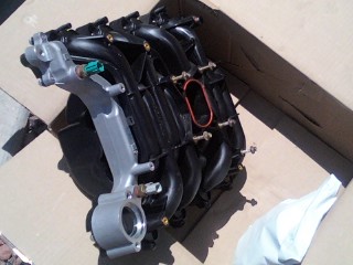 1997 Ford Crown Victoria - The new Intake Notice that the coolant crossover is aluminum instead of plastic. I decided to tackle this job myself because all I had to c…