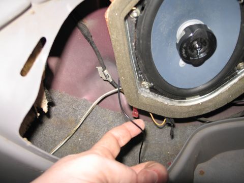 1995 Ford Bronco - Close-up view of a vehicle's interior speaker and associated wiring.