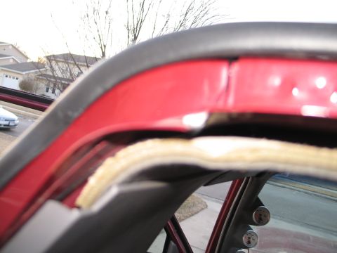 1995 Ford Bronco - Close-up of vehicle interior showing gauges and red trim panel.