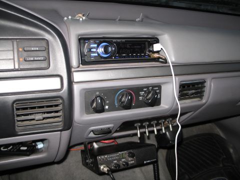 1995 Ford Bronco - Interior view of a 1995 Ford Bronco, an aftermarket stereo and CB radio installation.