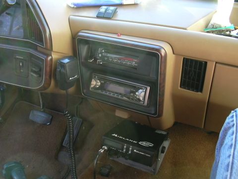 1991 Ford Bronco - Interior view of a vehicle's dashboard, showing an aftermarket radio and a CB radio unit.