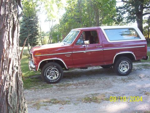 1985 Ford Bronco - This 1985 Ford Bronco is shown in a side profile, parked outdoors.