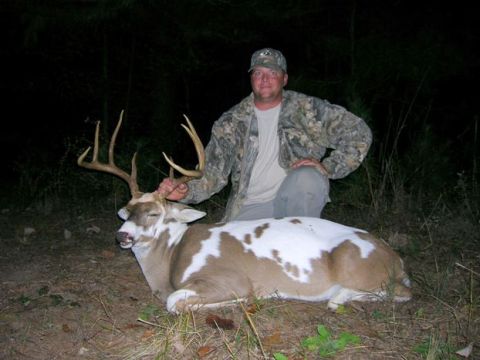 2004 Jeep Wrangler - Hunter poses with a unique piebald deer after a hunt.