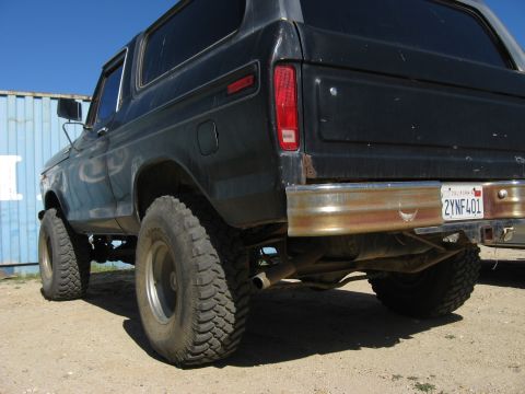 1979 Ford Bronco - This 1978 Ford Bronco is shown from the rear, off-road tires and a weathered chrome bumper.