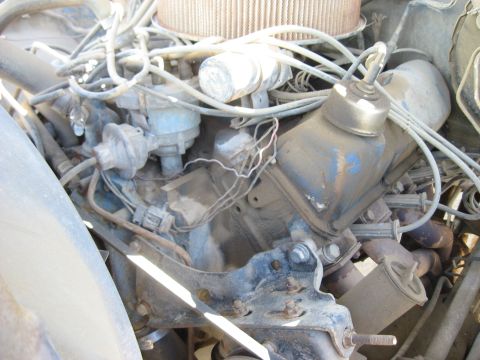 1979 Ford Bronco - Close-up view of an engine bay, showing various components and wiring.