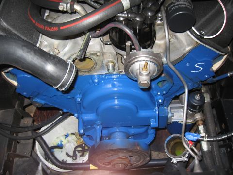 1968 Shelby GT500 - Close-up view of an engine compartment, showing various mechanical components and blue paint on the block.