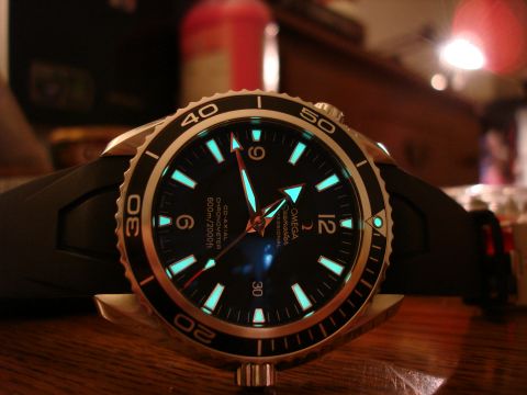 1994 Ford Bronco - Close-up of an Omega Seamaster watch face, showing its luminous hour markers and bezel.