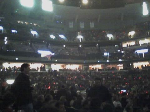 2004 Land Rover Land Rover - Interior view of a crowded stadium during a concert event.