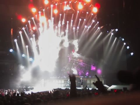 2004 Land Rover Land Rover - A concert stage erupts with pyrotechnics and bright lights during a performance.