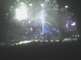 2004 Land Rover Land Rover - A band performs on a brightly lit stage during a concert.