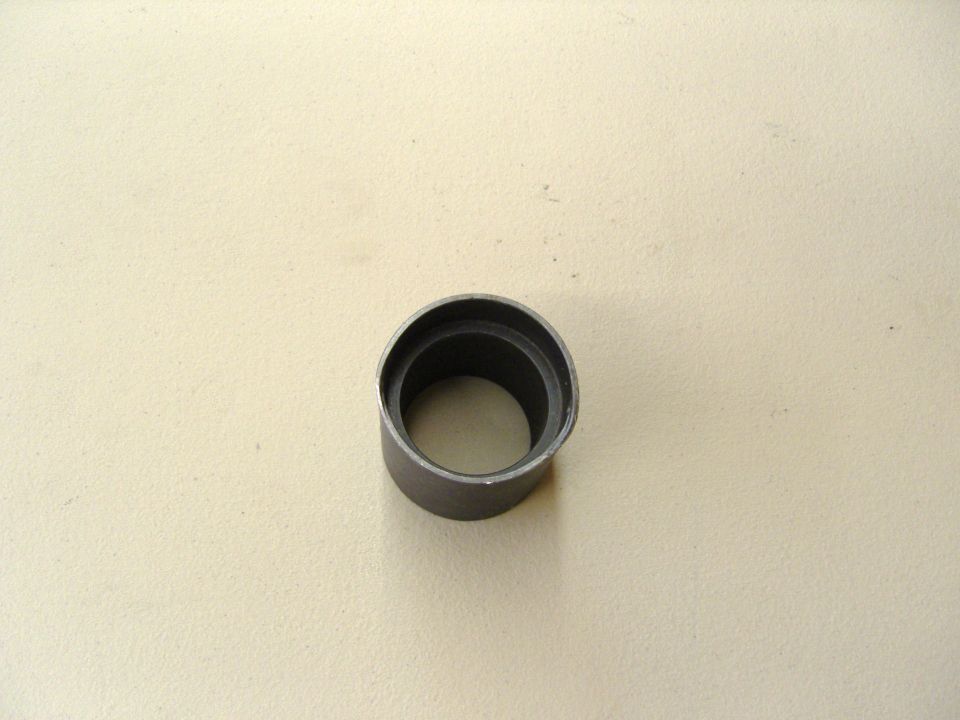 Photo of a cylindrical metal bushing or sleeve