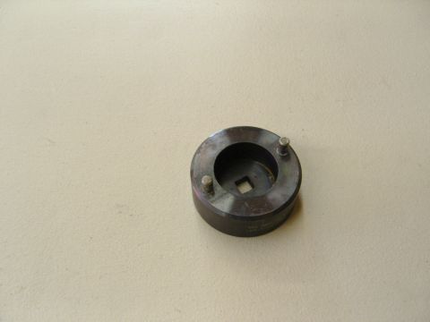 2007 Ford Mustang - Photograph of a pin-type spanner socket service tool, not a document.
