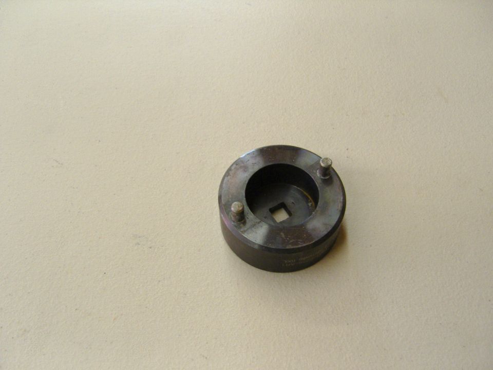 Photo of a round spanner socket tool with drive pins