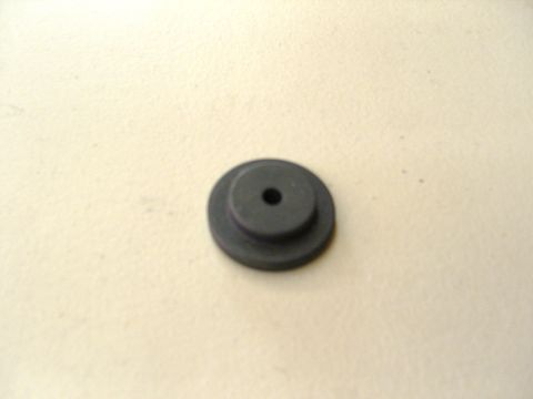 2007 Ford Mustang - Photograph of a black rubber grommet, not a technical document.
