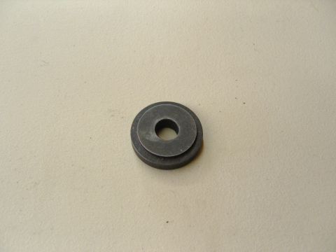2007 Ford Mustang - Photograph of a stepped metal washer/spacer, not a technical document.