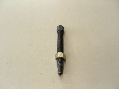 2007 Ford Mustang - Photograph of a threaded bolt/stud with a jam nut, not a technical document.