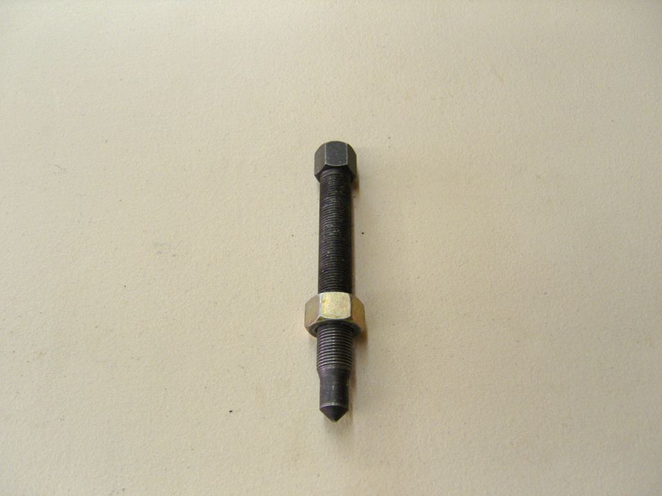 Photo of a threaded bolt stud with hex jam nut and pointed tip