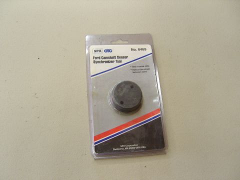 2007 Ford Mustang - Photograph of an SPX OTC camshaft sensor synchronizer tool in retail packaging, not a technical document.
