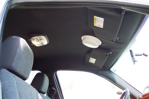 2001 Ford Crown Victoria - Interior view of a car, focusing on the headliner and sun visors.