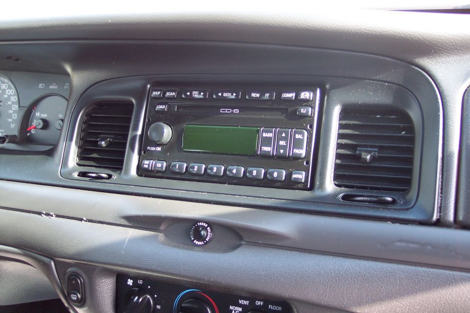 Interior dashboard of a 2001 Ford Crown Victoria showing the CD-6 radio and air vents
