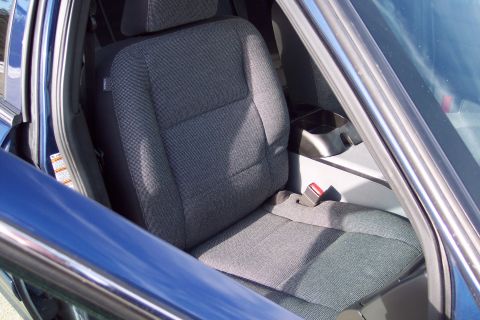 2001 Ford Crown Victoria - Interior view of a blue 2001 Ford Crown Victoria, highlighting the passenger seat and console.
