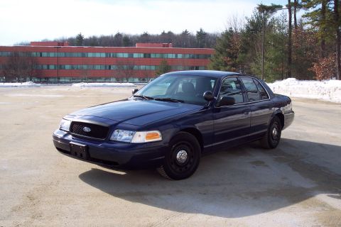 2001 Ford Crown Victoria - Dark blue 2001 Ford Crown Victoria in a parking lot with snow on the ground.