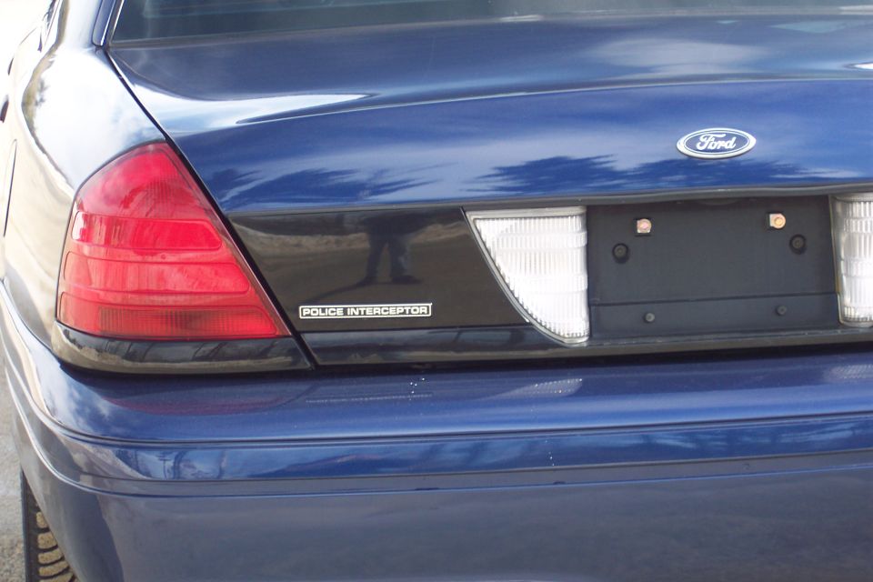 Blue 2001 Ford Crown Victoria Police Interceptor rear with Ford badge