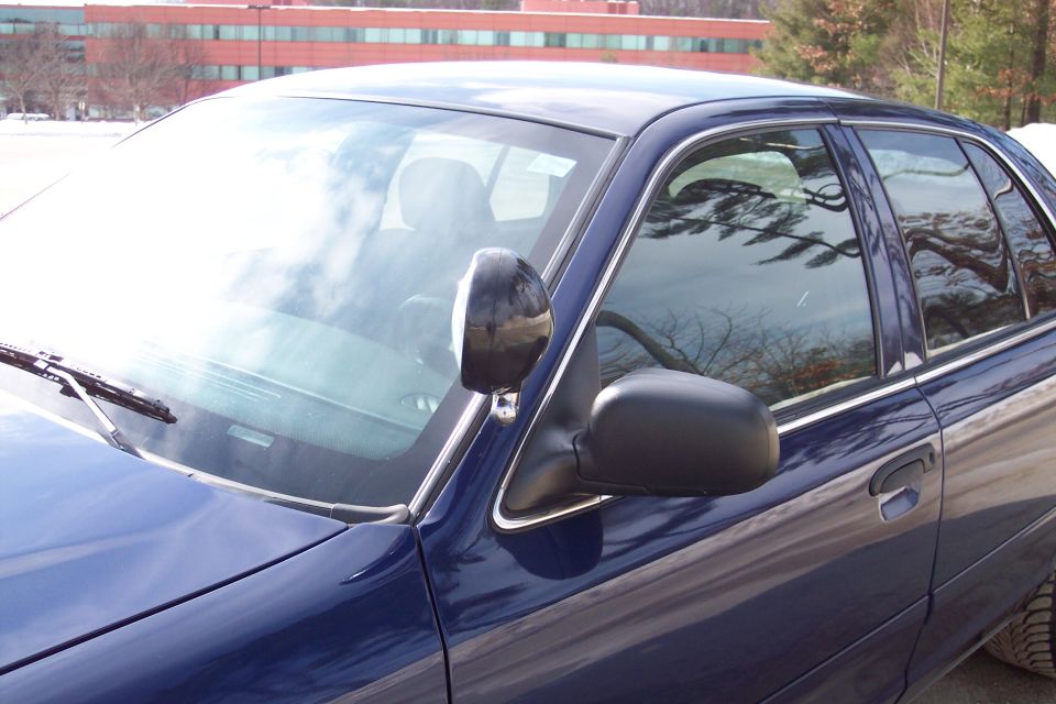 2001 Ford Crown Victoria side view, blue paint, black mirrors