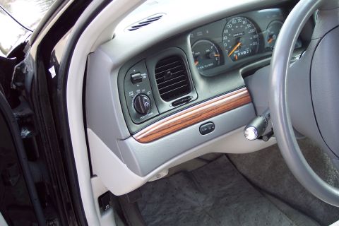 2001 Ford Crown Victoria - Interior view of a 2001 Ford Crown Victoria, showing the dashboard, steering wheel, and instrument cluster.