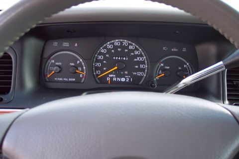 2001 Ford Crown Victoria - The interior dashboard gauges show an odometer reading of 024183 miles.