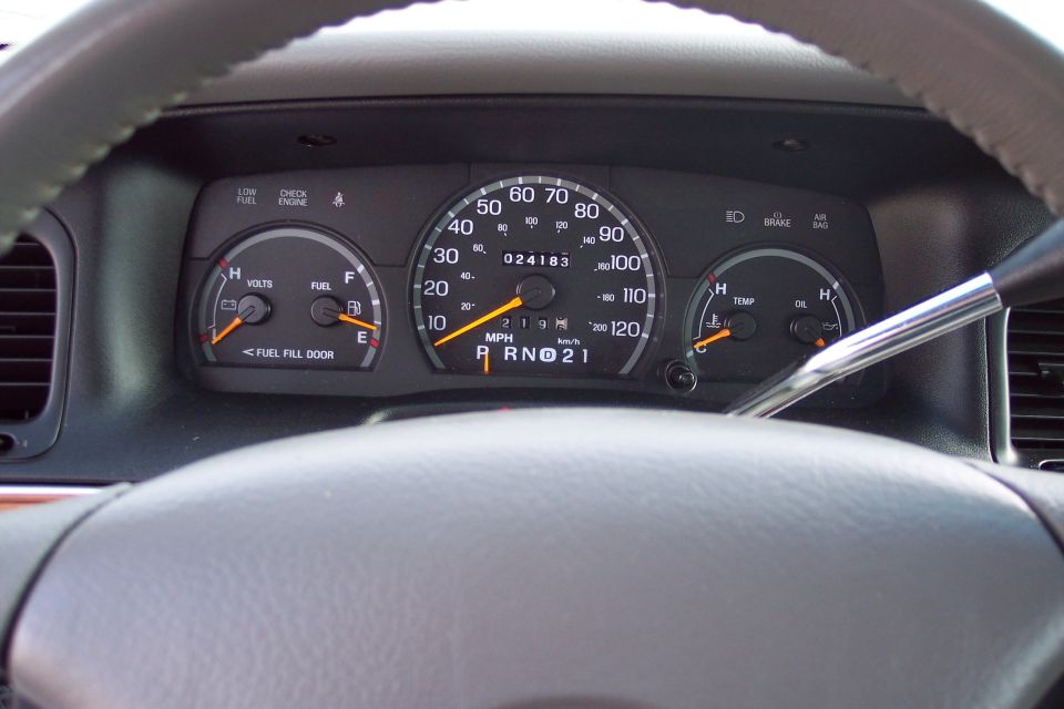 Interior dashboard gauges with odometer reading 024183