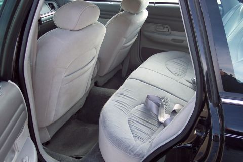 2001 Ford Crown Victoria - The interior of a 2001 Ford Crown Victoria shows light gray cloth seats and carpeting.