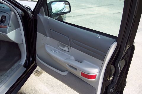 2001 Ford Crown Victoria - Interior view of the driver's side door panel on a 2001 Ford Crown Victoria.