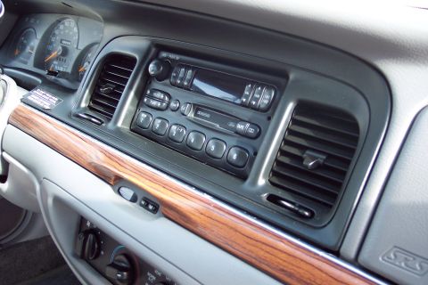 2001 Ford Crown Victoria - Interior view of a 2001 Ford Crown Victoria, showing the dashboard, radio, and air vents.