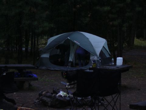 1991 Ford Bronco - A campsite scene at dusk features a large tent, picnic table, and campfire, suggesting a camping trip during Dustbowl Fest 2004.