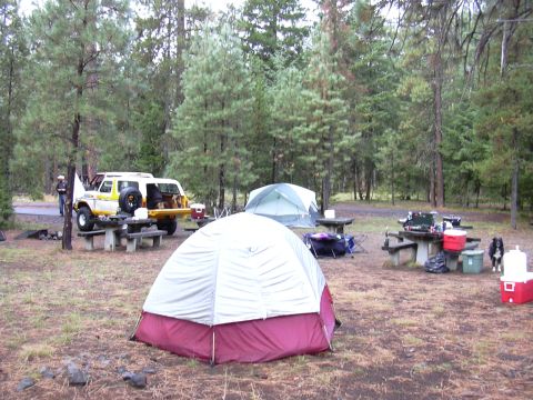 1991 Ford Bronco - A 1991 Ford Bronco is parked at a campsite, ready for outdoor adventures.