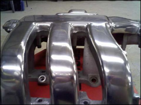 1994 Ford Probe - Polished intake manifold with a shiny, reflective finish.