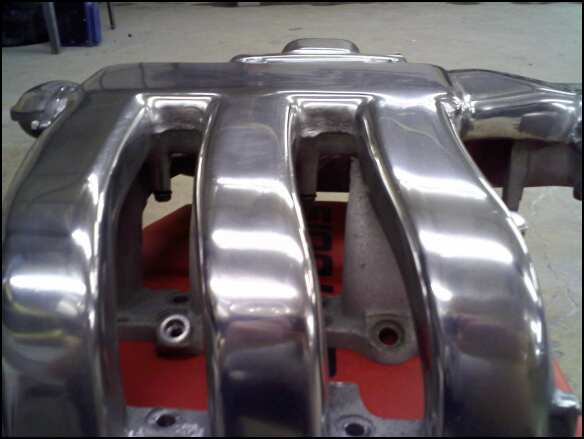 Polished aluminum intake manifold with multiple runners