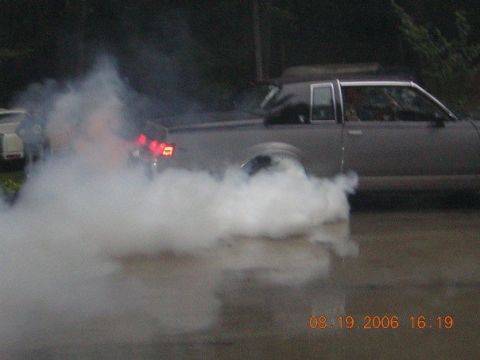 1972 Ford Ranchero - A car performs a burnout, kicking up a large cloud of smoke. The timestamp indicates the photo was taken on August 19, 2006.