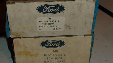 1979 Ford Bronco - Boxes of Ford tow hooks are stacked, showing part numbers and branding.