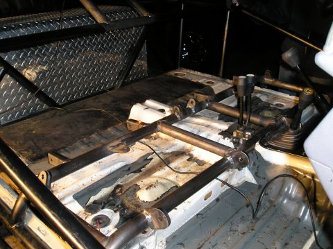 1986 Toyota Hilux - Custom interior modifications include a roll cage and dual gear shifters, suggesting off-road or racing use.