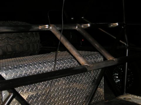 1986 Toyota Hilux - Custom metal fabrication and toolbox visible in the rear of a vehicle.