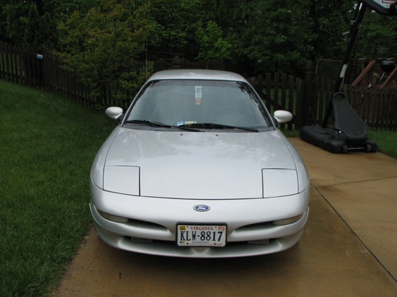 Silver Ford Probe parked in driveway, front view. License plate KLW-8817