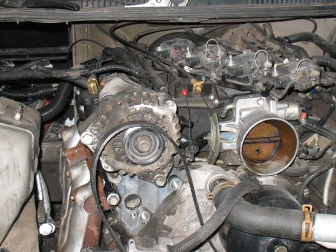 2001 Pontiac Trans Am - Close-up view of a vehicle's engine bay, showing various components and wiring.