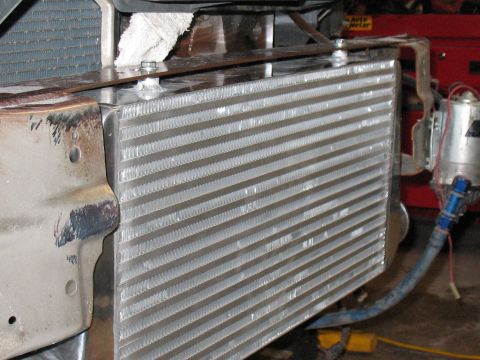 2001 Pontiac Trans Am - Close-up of an intercooler installation, showing plumbing and mounting hardware.
