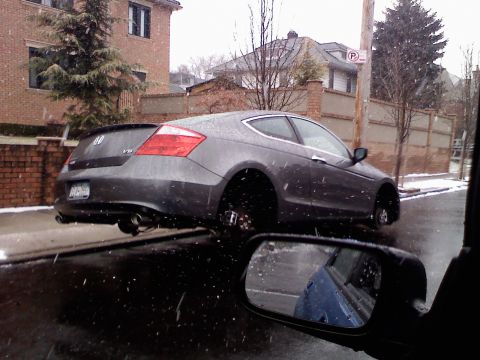 2007 Subaru Impreza - Honda Accord coupe missing wheels on a snowy day.