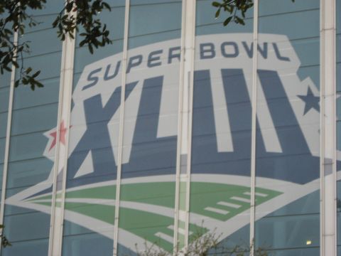 1973 Ford Torino - The Super Bowl XLIV logo is displayed prominently on the exterior of a building.